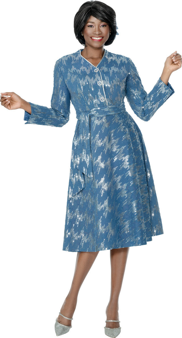Woman wearing a blue patterned dress on a white background